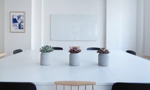 Image of a boardroom and clean whiteboard